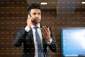 
									black suite, business, man, manager, professional, standing , smart ,calling , explaining , mobile phone 