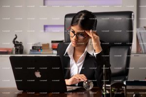 sitting on chair, office, professional, girl, laptop, working on laptop, full suite, black suite, business, disappointed, specs girl, girls, thinking, sitting in office, , meeting, business lady