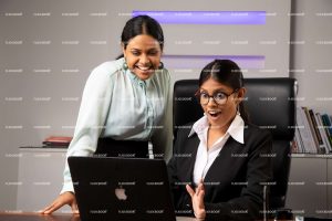 sitting on chair, office, professional, girl, laptop, landscape, working on laptop, full suite, black suite, business, happy, smile, wow, excited, laughing, specs girl, girls, thinking, sitting in office, , meeting, business ladies