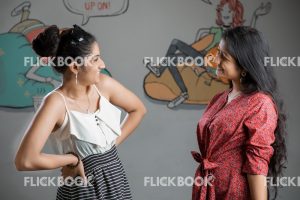 Emotions , girls , standing , casual outfit , happy ,  posing  , chatting , laughing , staring at each other , students  