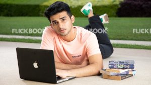 
									Emotions , a boy , laying down , casual outfit , thinking ,  posing , laptop , books , legs crossed , at a garden , sad , tired , stressed 