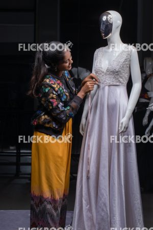 
									Woman working as a tailor, Woman making measures, Fashion, Design, Designer,  Clothes. Mannequin, Dummy, casual outfit , smiling , hard work , 