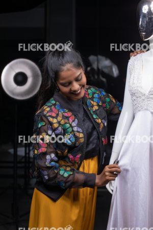 
									Woman working as a tailor, Woman adjusting dummy dress , Fashion, Design, Designer,  Clothes. Mannequin, Dummy, casual outfit , smiling , hard work , happy