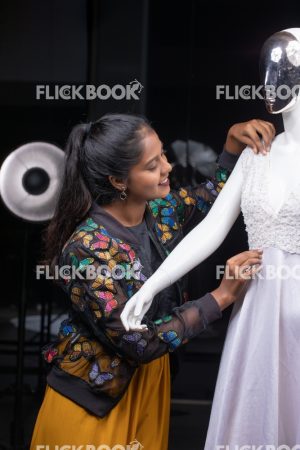 
									Woman working as a tailor , Fashion, woman adjusting dummy dress, Design, Designer,  Clothes. Mannequin, Dummy, casual outfit , smiling , hard work , happy , smiling , looking at dummy 