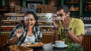 
									Food , a couple , having a breakfast meal  , smiling , happy , at a cafeteria , having a glass of coffee / tea