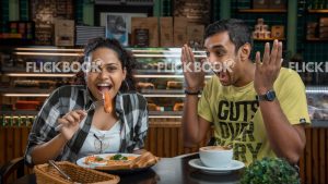 Food , a couple , having a breakfast meal  , smiling , happy , at a cafeteria , having a glass of coffee / tea