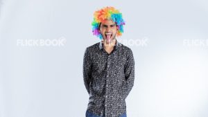 Entertainment , clown , happy , smiling , enjoying , standing , a boy , tongue out 