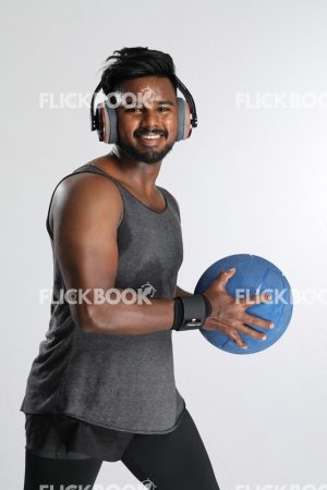 Man Wearing Headphones, Holding Mini Pilates Ball, Mini Exercise Ball, Smiling, Strong Guy
