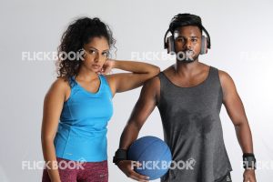 
									Fitness , a couple , sporty , guy holding ball ,  girl’s elbow on guy’s shoulder , tired , sweaty 
