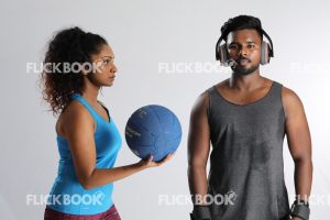 
									Fitness , a couple , sporty , girl holding ball , tired , sweaty 