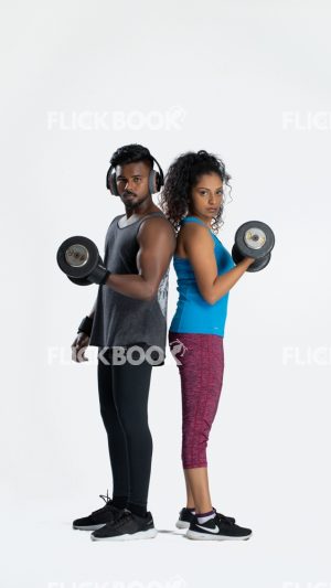 
									Fitness , a couple , sporty , both holding dummbbells , tired , sweaty , staring