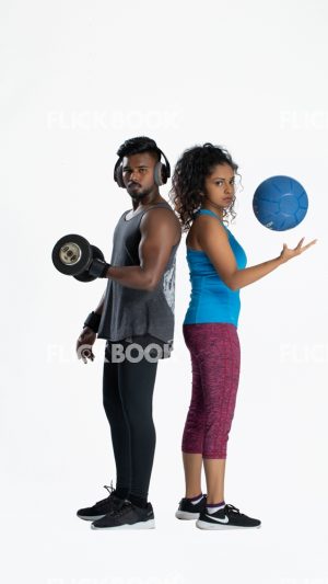 
									Fitness , a couple , sporty , guy holding dummbbells , tired , sweaty , staring , girl holding a ball 