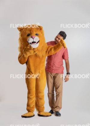
									Entertainment , lion costume , brown , a guy standing , laughing , brown  , standing , staring 