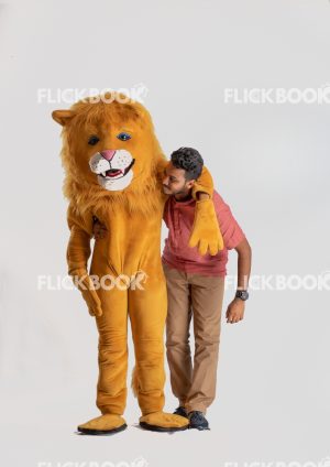Entertainment , lion costume , brown , a guy standing , laughing , brown  , standing , hand on shoulder 