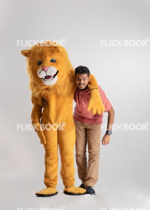 
									Entertainment , lion costume , brown , a guy standing , laughing , brown  , standing , hand on shoulder 