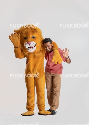 Entertainment , lion costume , brown , a guy standing , laughing , brown  , standing , hand on shoulder 