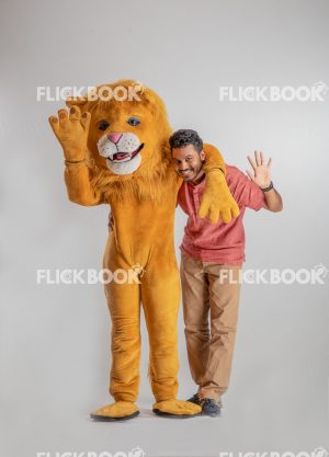 Entertainment , lion costume , brown , a guy standing , laughing , brown  , standing , hand on shoulder , waving