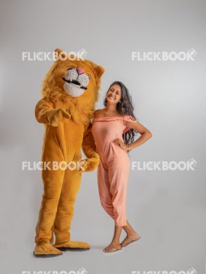 
									Entertainment , lion costume , brown , a girl standing , laughing , brown  , standing , enjoying , mascot