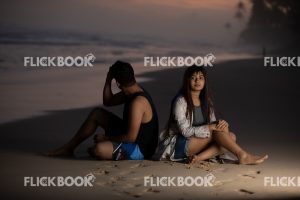 
									Entertainment , A couple, at beach , sitting on a beach , thinking , looking at sea , tired , sad 