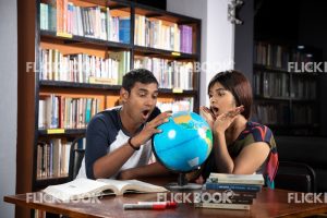 
									Library , a couple , world map ball , studying , looking , staring , searching , books , surprised 