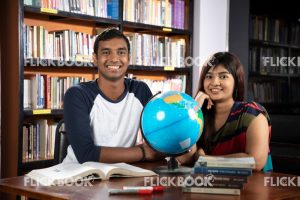 
									Library , a couple , world map ball , studying , looking , staring , searching , books , surprised , smiling , happy 
