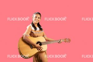 Talents , girl, playing guitar , smiling , enjoying 