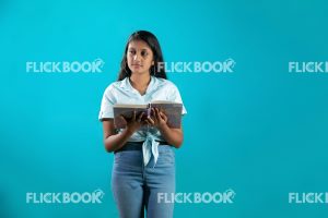 Talents , girl, reading a book  , smiling , enjoying , concentrating , standing 