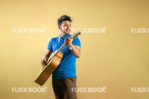 
									Talents , boy, playing guitar , standing , casual outfit 