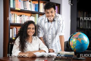 
									Library , a couple , world map ball , studying , looking , staring , searching , books , smiling , happy , posing 