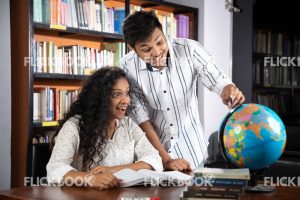 
									Library , a couple , world map ball , studying , looking , staring , searching , books , happy , pointing , learning , teaching , surprised 