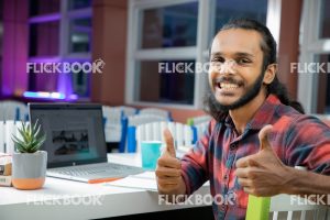 
									Library , boy, cup , laptop , book , thumbs up , books , smiling , casual outfit , sitting , happy 