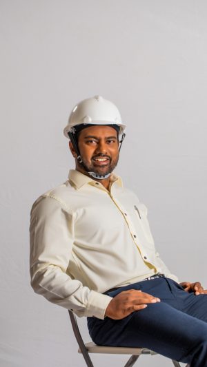 Occupations , contractor, busy ,  formal outfit , guy ,  sitting 