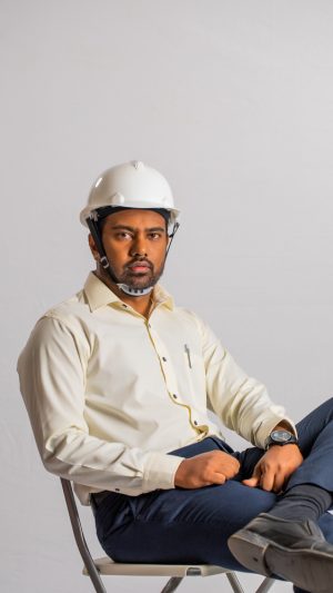 Occupations , contractor, busy ,  formal outfit , guy ,  sitting 