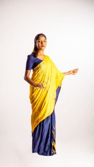 
									Occupations , teacher , girl , file , standing , wearing saree , strict , punishing , stick 