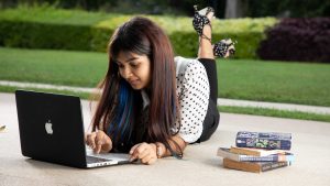 
									Student Life , girl , studying , using laptop , staring , lying down on floor , crossed legs , happy