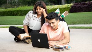 
									Student Life , couple , studying , using laptop , staring , lying down on floor , crossed legs , 